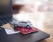 toy-car-credit-cards-laptop-keyboard-concept-about-paying-tax-insurance-car-loan-business-transportation-financial-concept_42299-2147